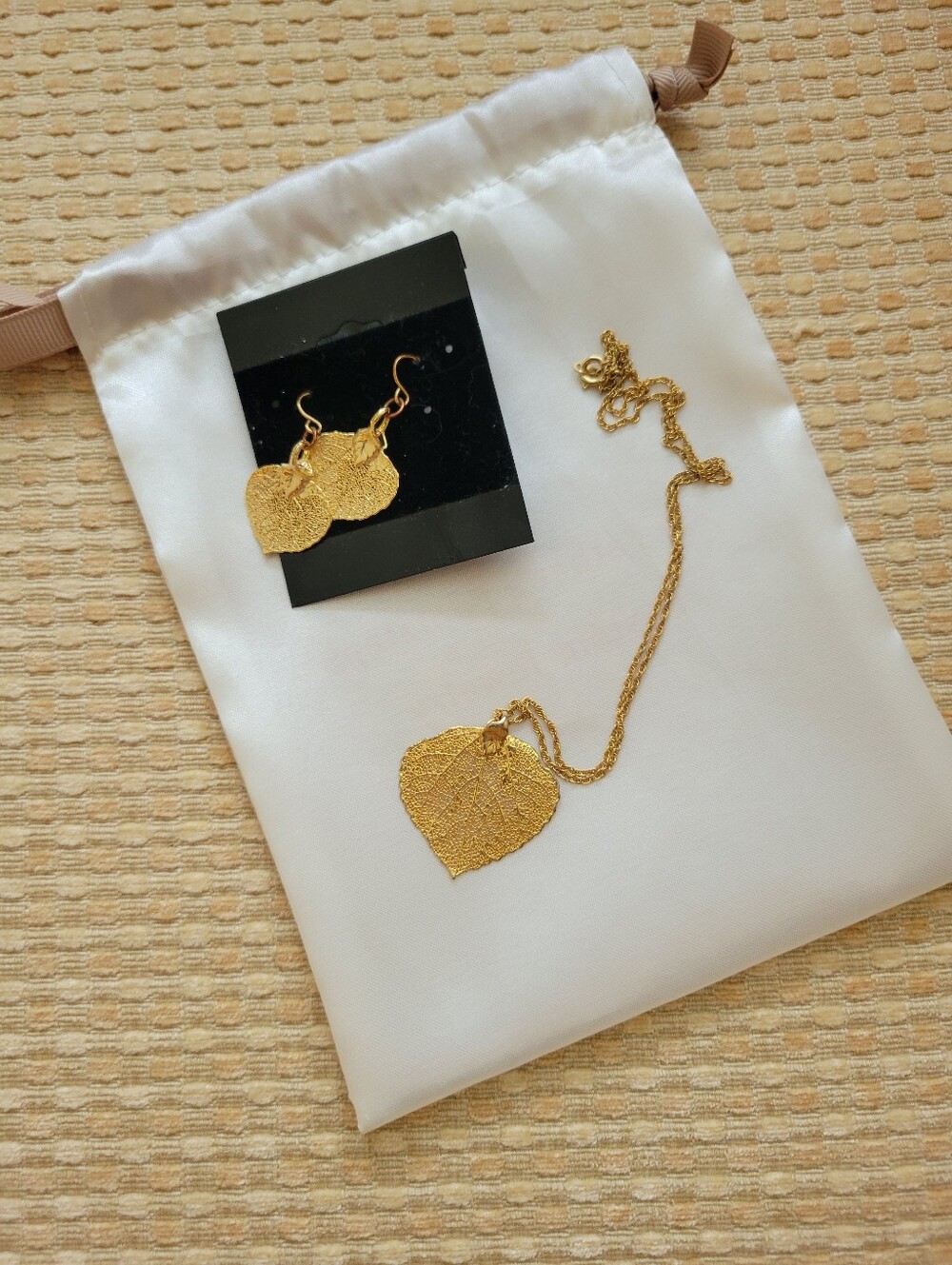 Gold lacy leaf earrings and necklace. Never Worn.
